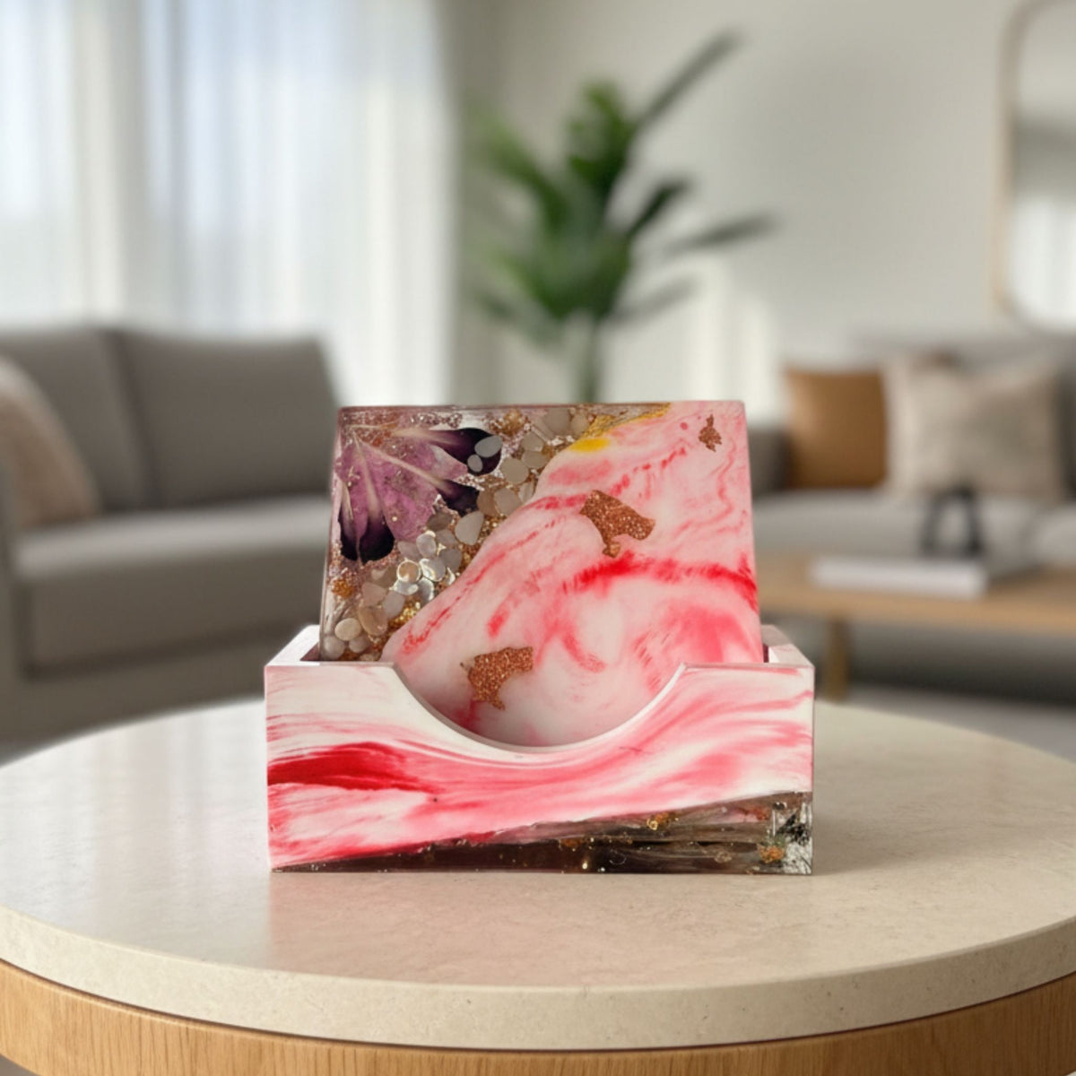 Set of four handmade pink marble-effect coasters with floral details, decorative stones and translucent edges
