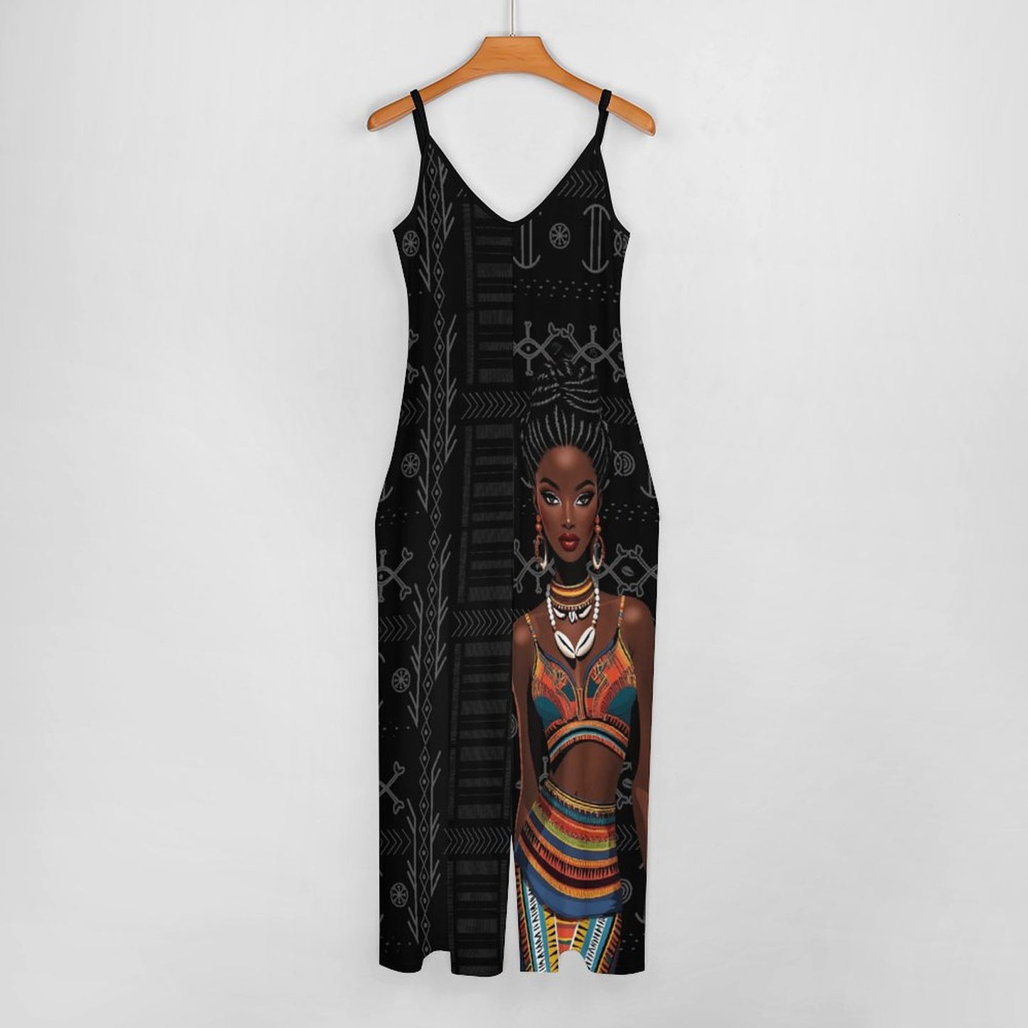 Black jumpsuit with an African-inspired design on a hanger against a white background