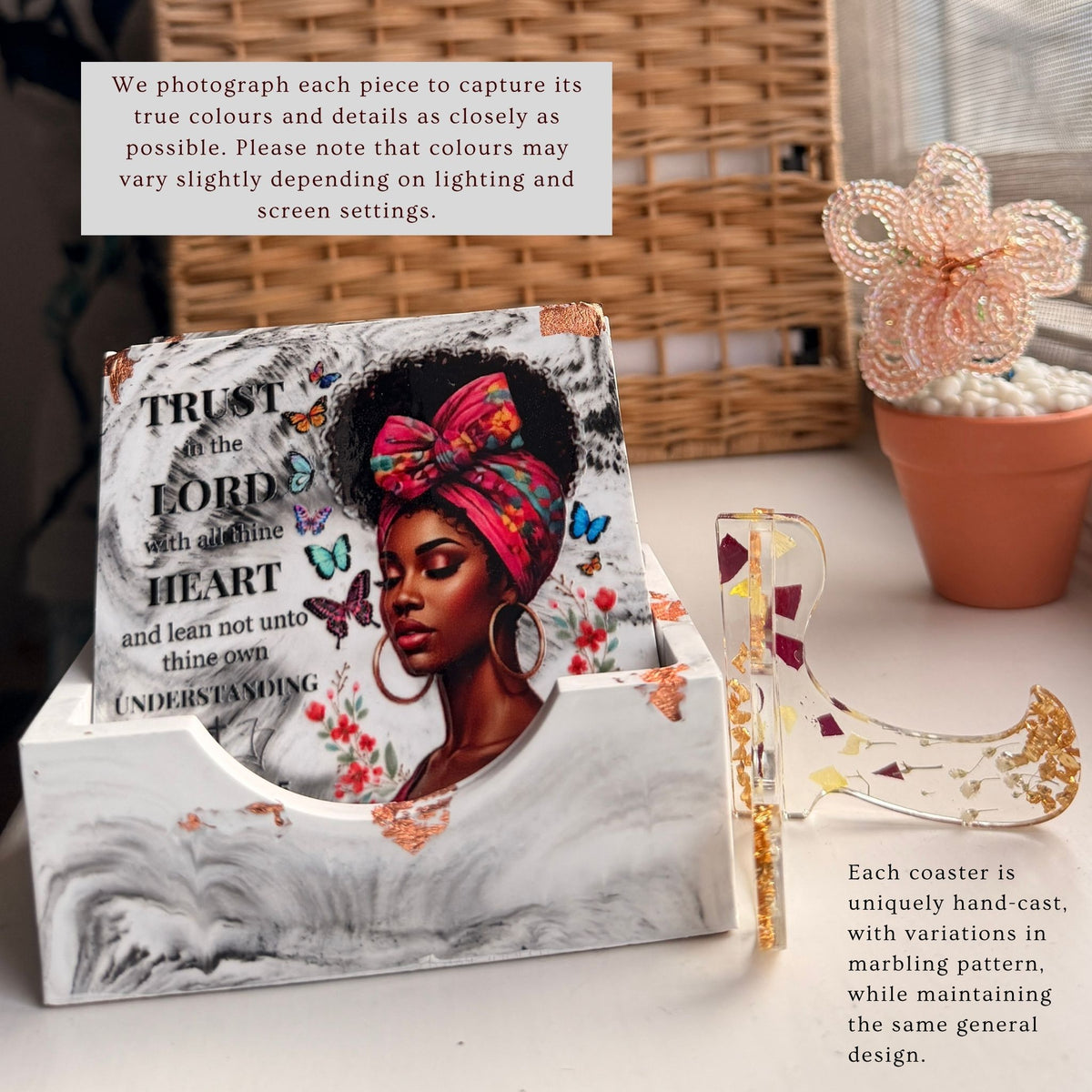 Charcoal and white Bible verse coaster set of four displayed on its presentation case, with a stand beside it
