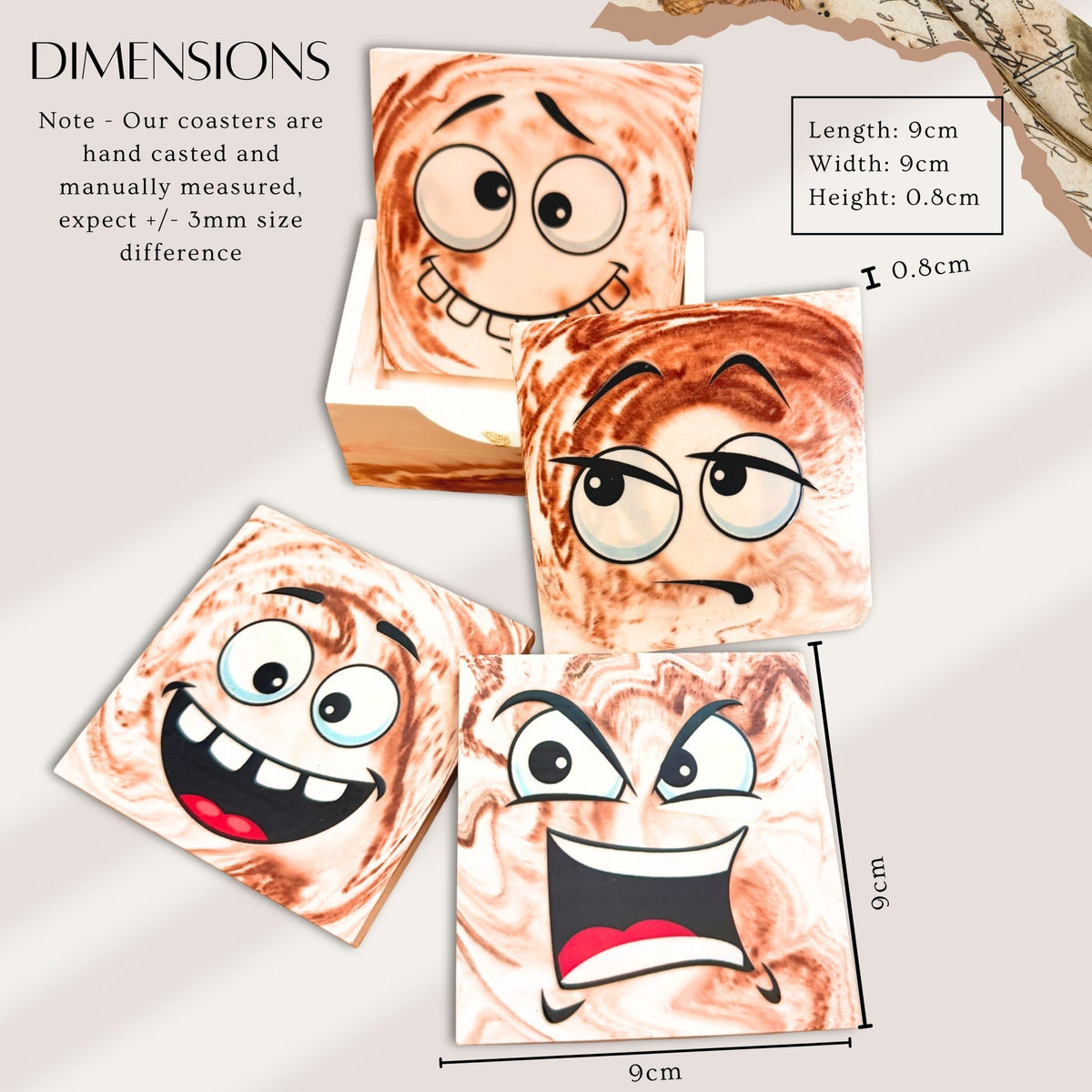 Set of four Mood Swings handmade eco-ceramic coasters featuring different funny facial expressions on brown and cream marble-effect backgrounds. With dimensions 9cm x 9cm x 0.8cm